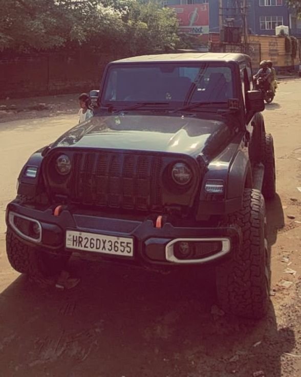 Front view of the Thar on a dusty road in bright sun